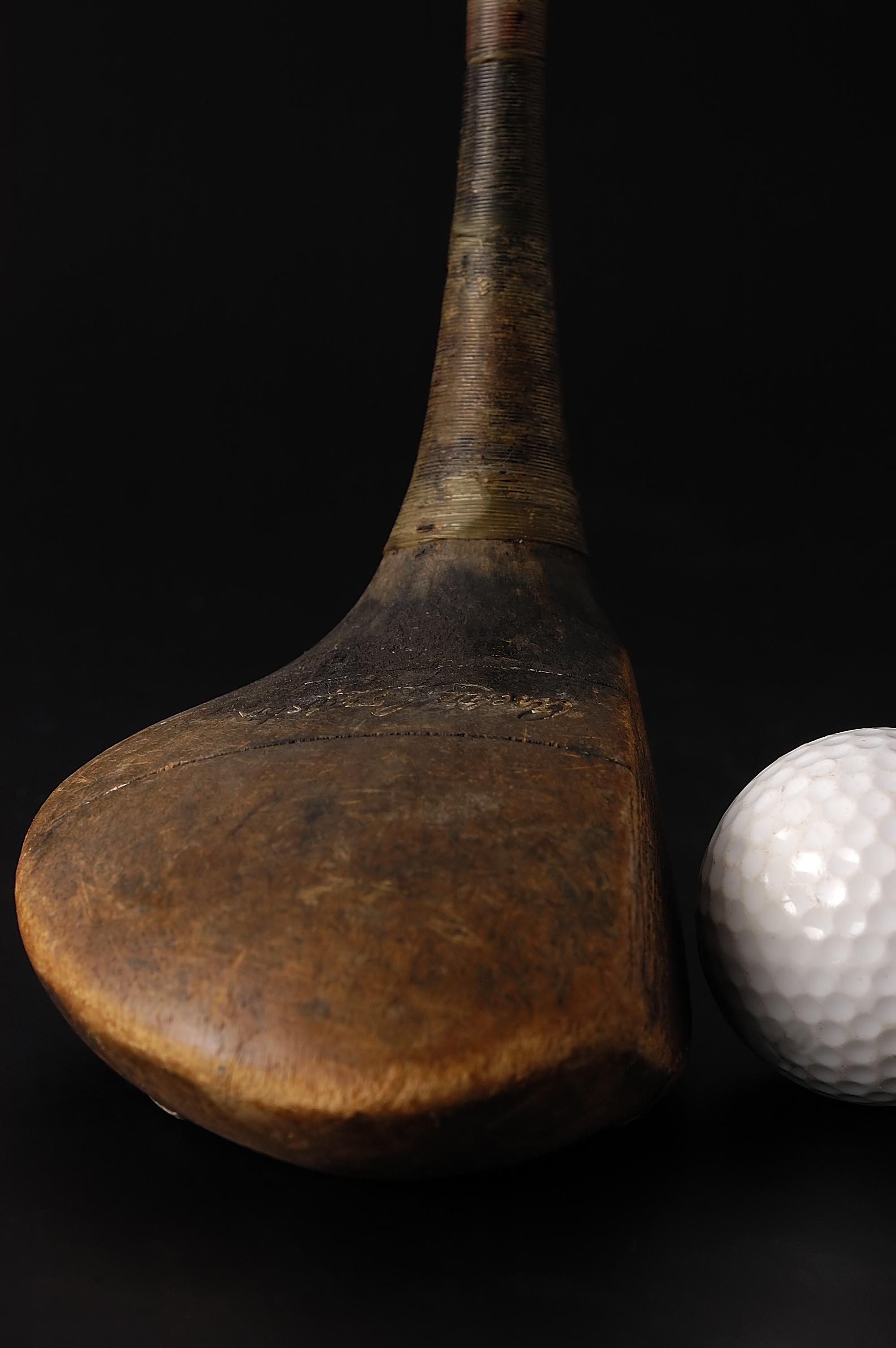 A,Golf,Ball,And,Club,With,Selective,Focus